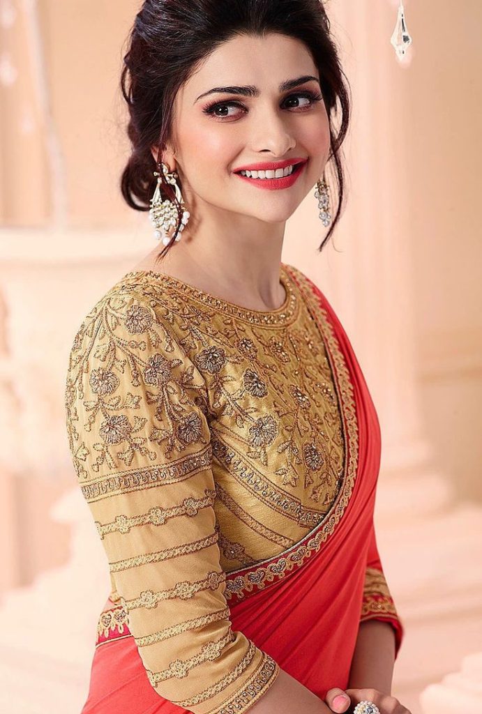 Red Saree with a Rich Gold Blouse