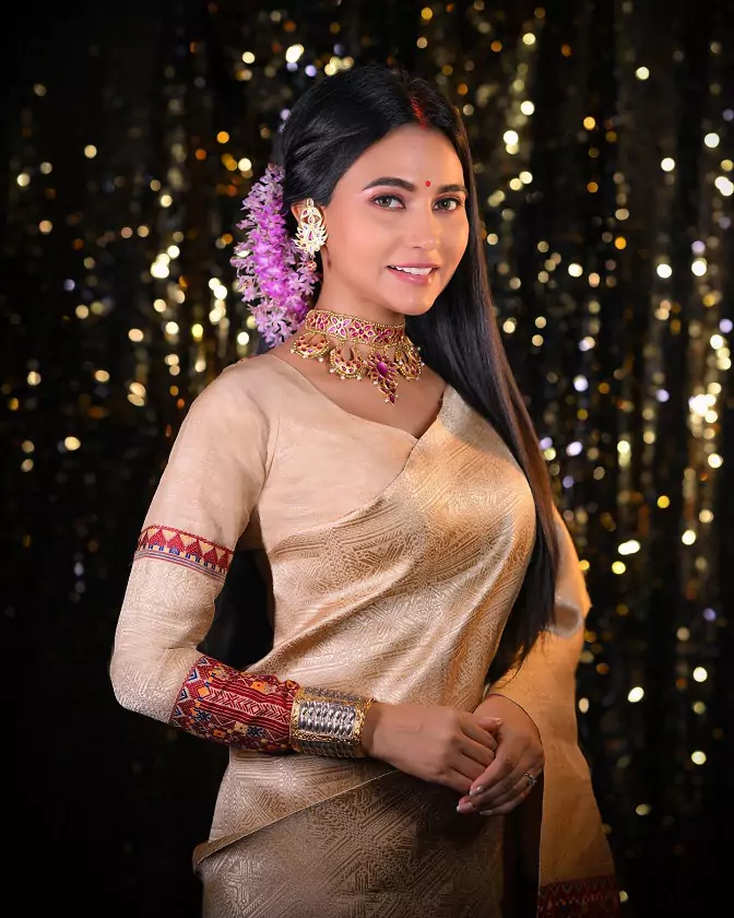 a woman in a gold dress